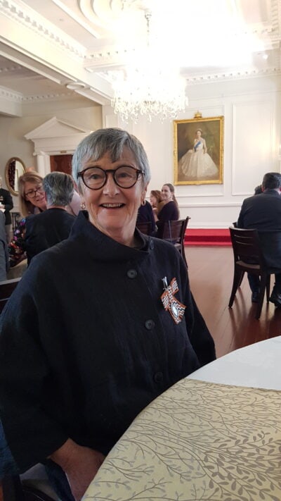 Gillian Bishop wearing her Queens Service Medal for services to conservation in New Zealand