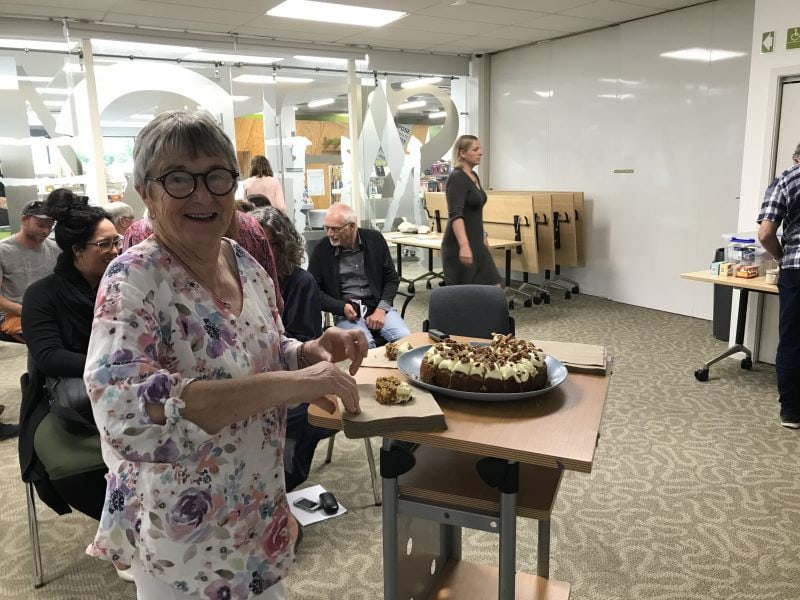 TET chair Gillian Bishop cuts the cake at TET's 20th anniversary celebration