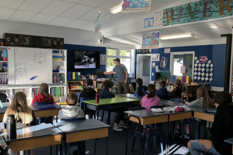 Barry Burger from Farmers for Whio giving a PowerPoint presentation to Room 5 students at Ngatimoti School