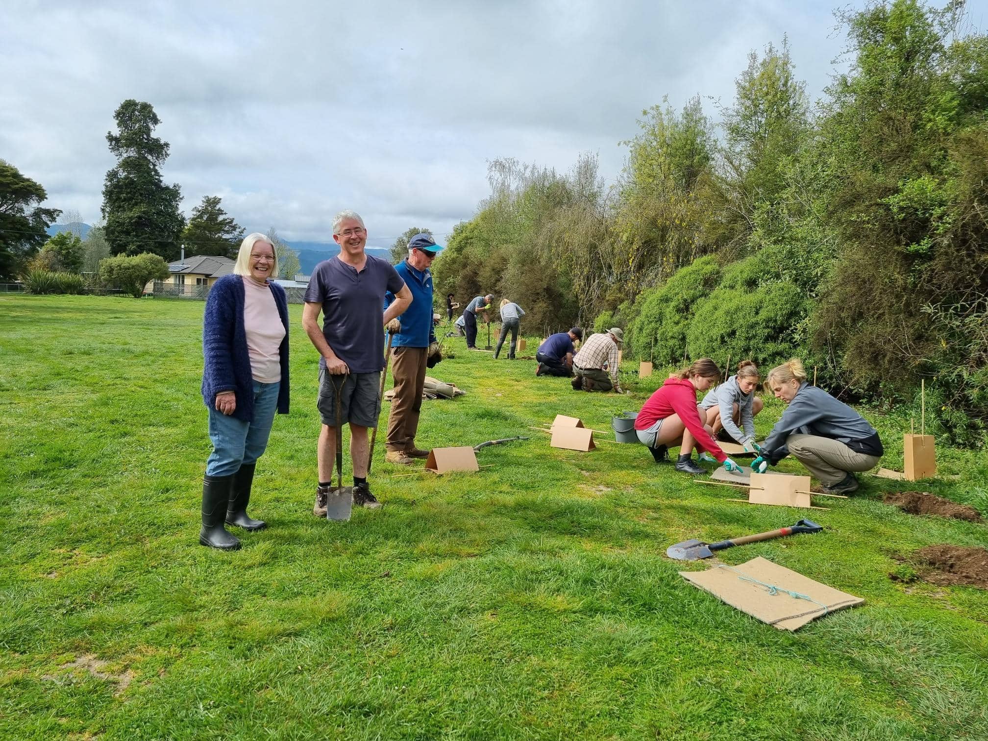 people planting at community planting day Snowden's Bush Brightwater