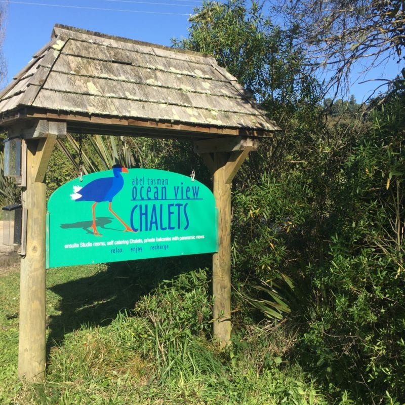 Welcome sign for the Ocean View Chalets at Abel Tasman