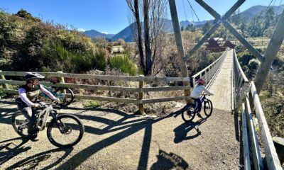 Cyclists ride over the Baton Bridge